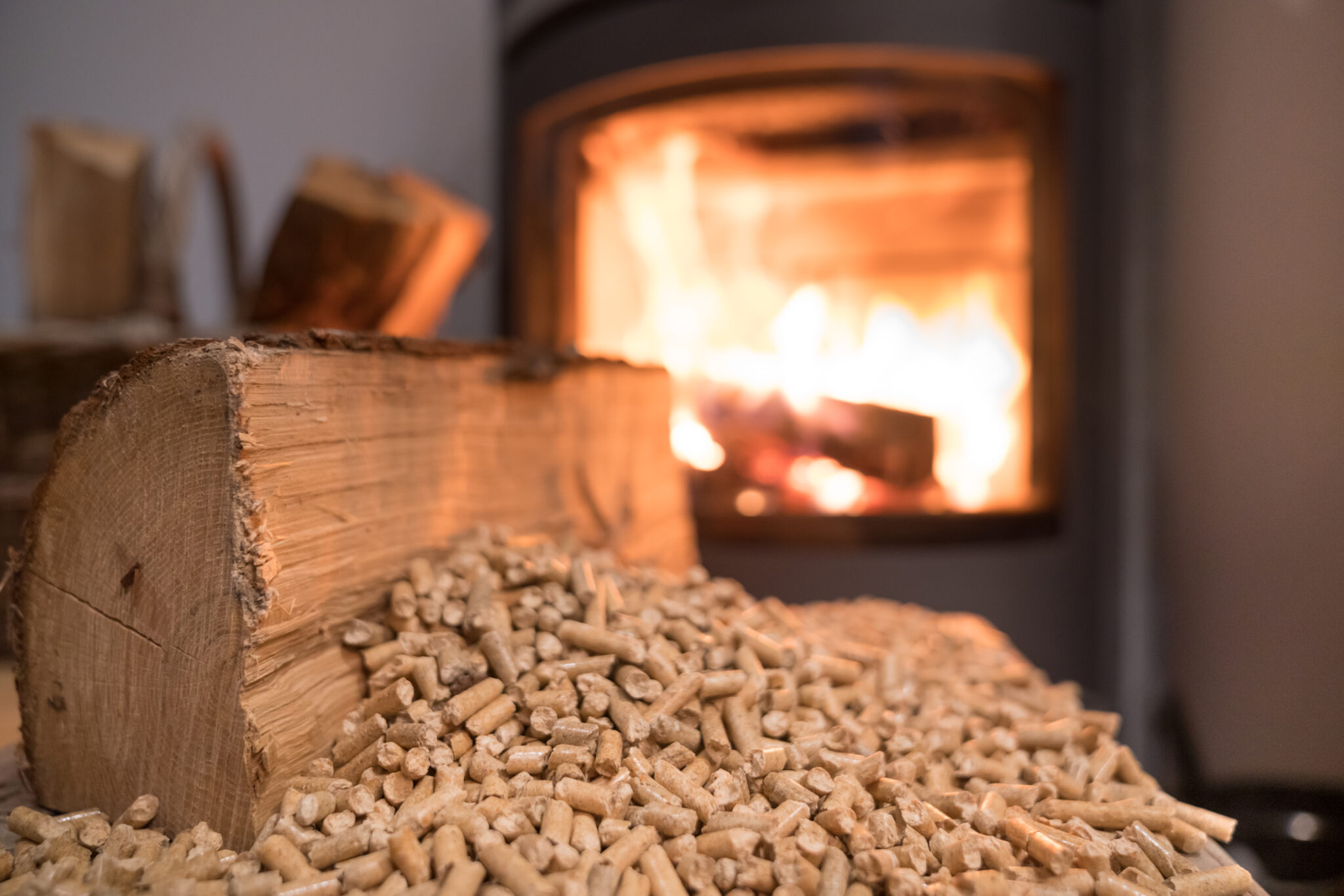 Wood stove heating with in foreground wood pellets